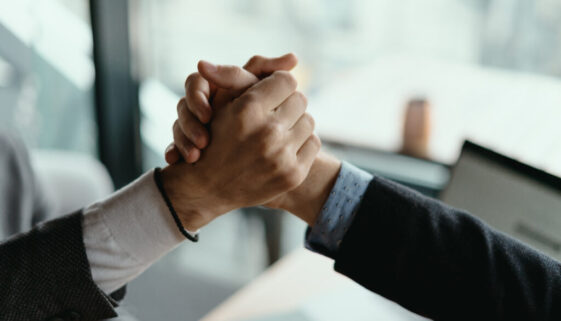 Two business men celebrating a deal